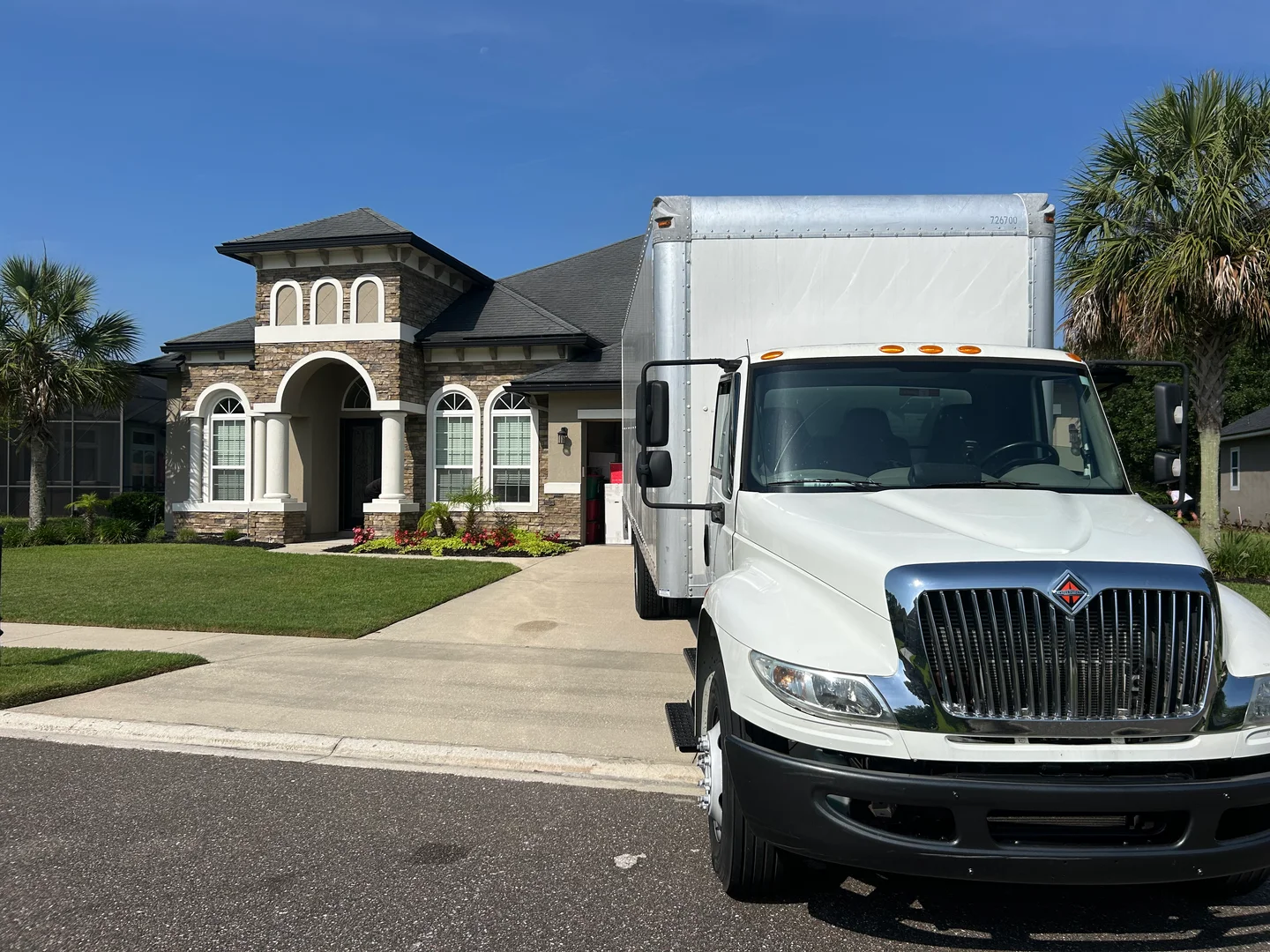 Happy 2 Help Moving crew reviewing moving agreement with customer in Riverside